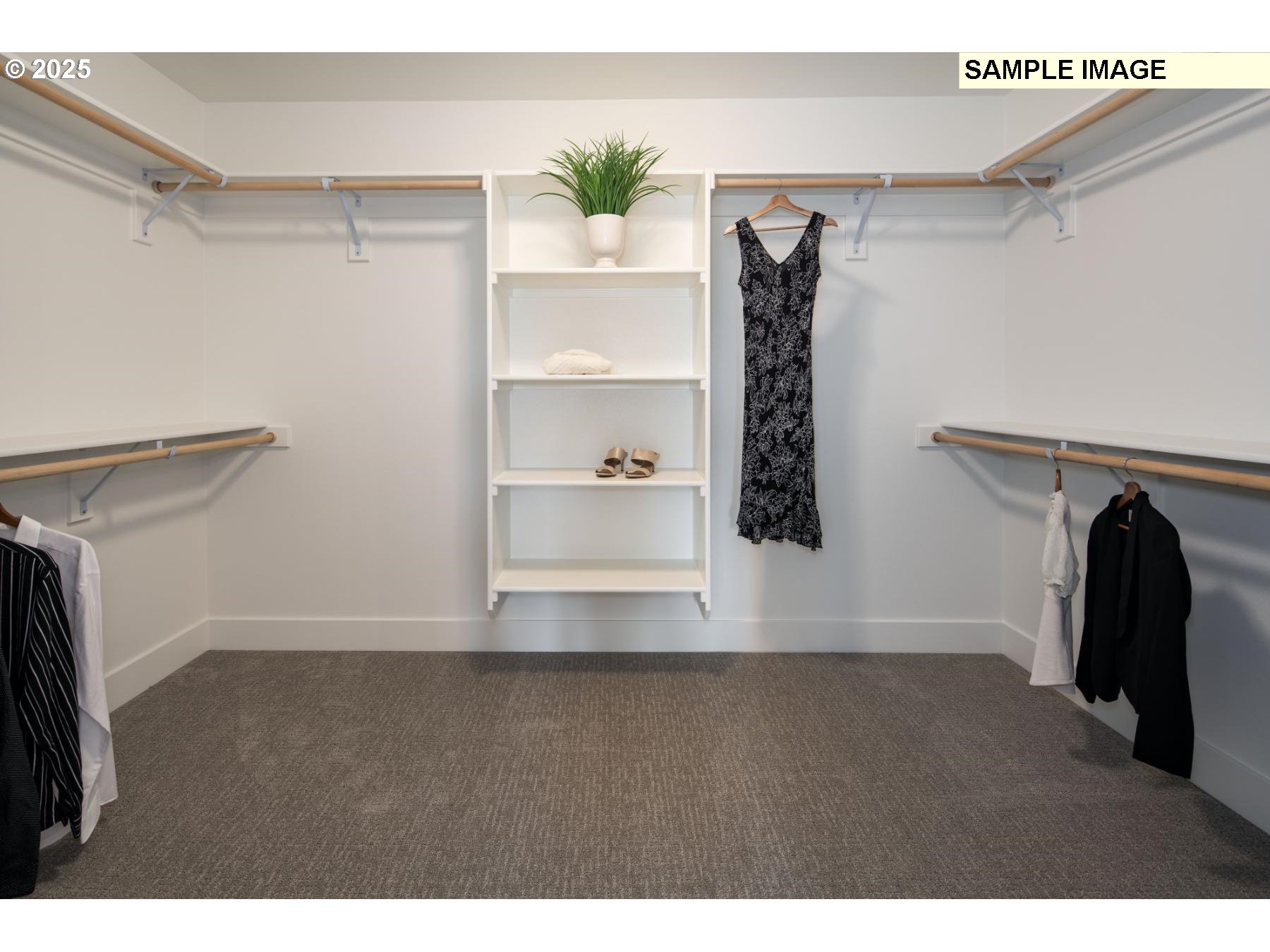 8119 North Hargrave Street Camas, WA 98607 - Photo 19 of 23 a view of walk in closet with clothes and shoes