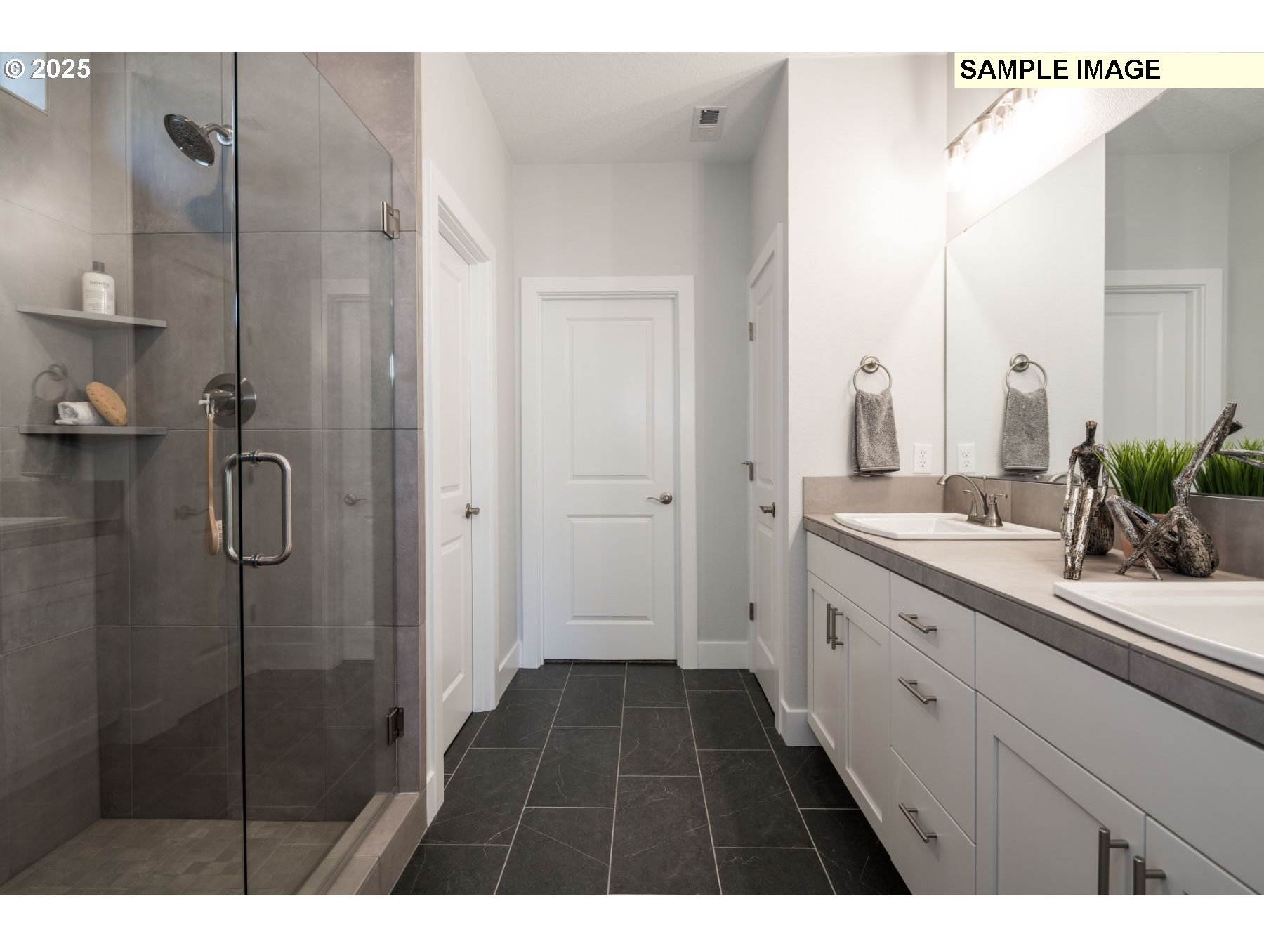 8119 North Hargrave Street Camas, WA 98607 - Photo 9 of 23 a bathroom with a double vanity sink a toilet and a mirror