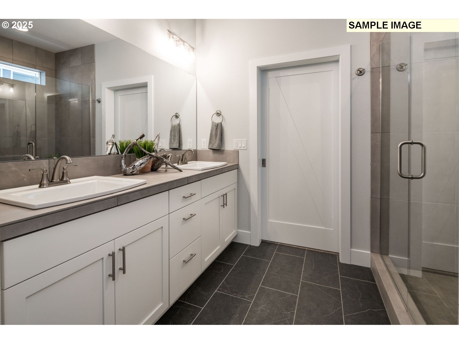 8119 North Hargrave Street Camas, WA 98607 - Photo 10 of 23 a bathroom with a double vanity sink and mirror