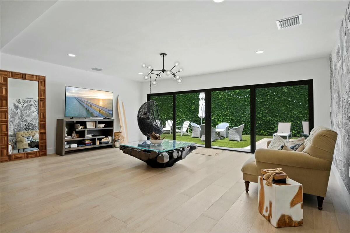 27 Ocean Drive Jupiter, FL 33469 - Photo 5 of 22 a view of a livingroom with furniture and floor to ceiling window