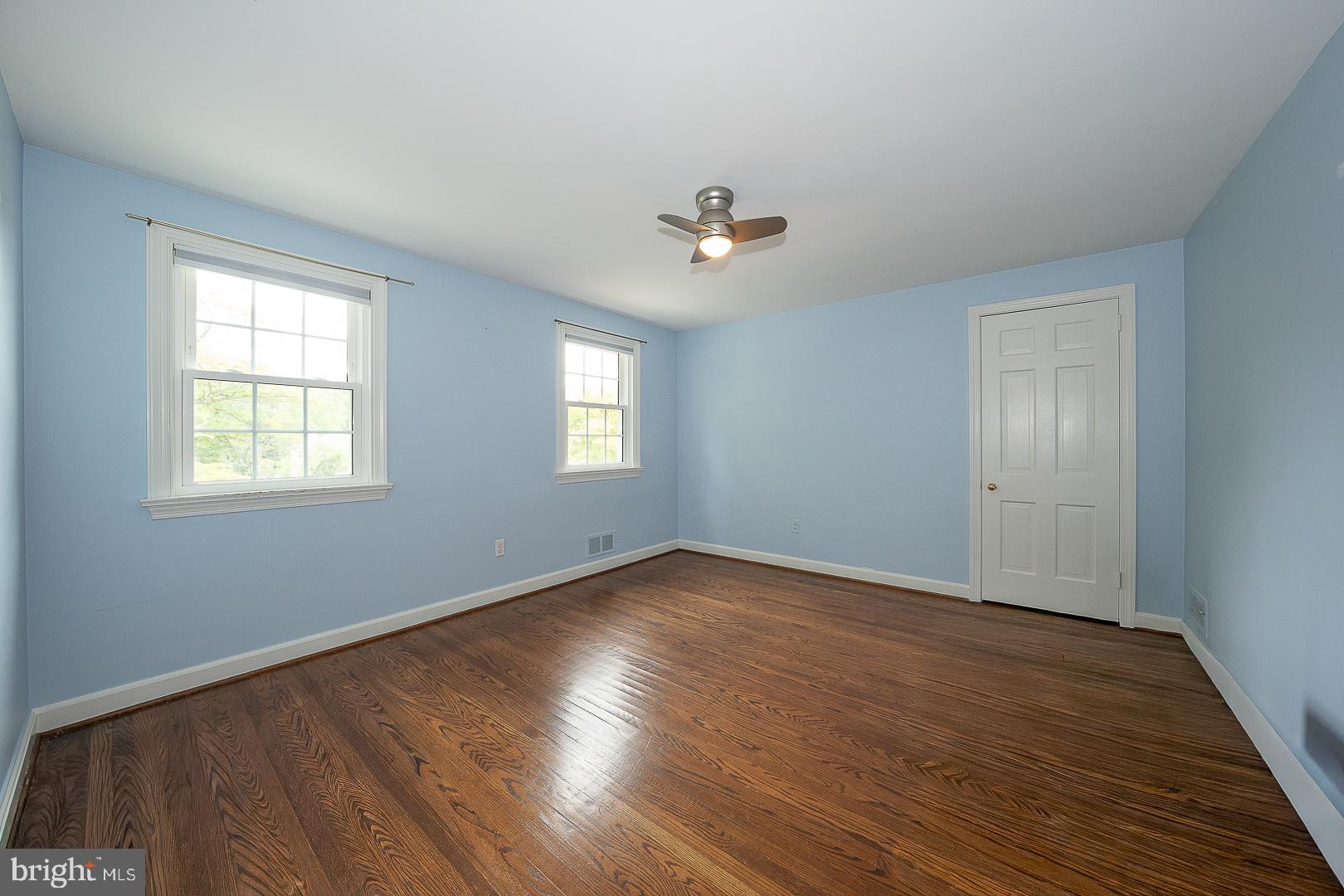 538 Conestoga Road Villanova, PA 19085 - Photo 28 of 39 a view of an empty room with wooden floor and a window