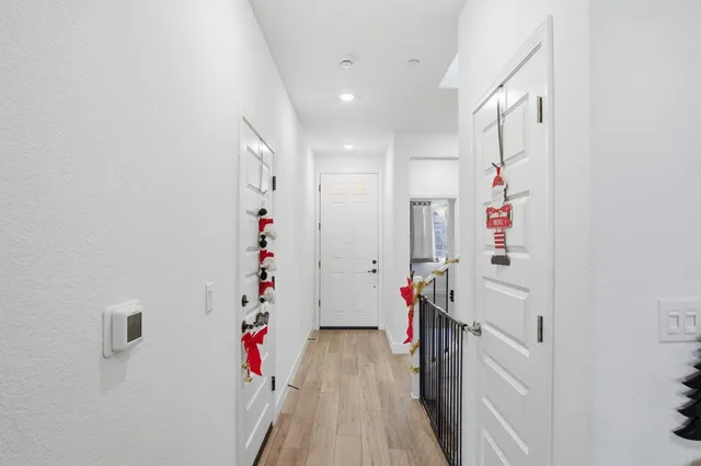a view of an entryway with wooden floor