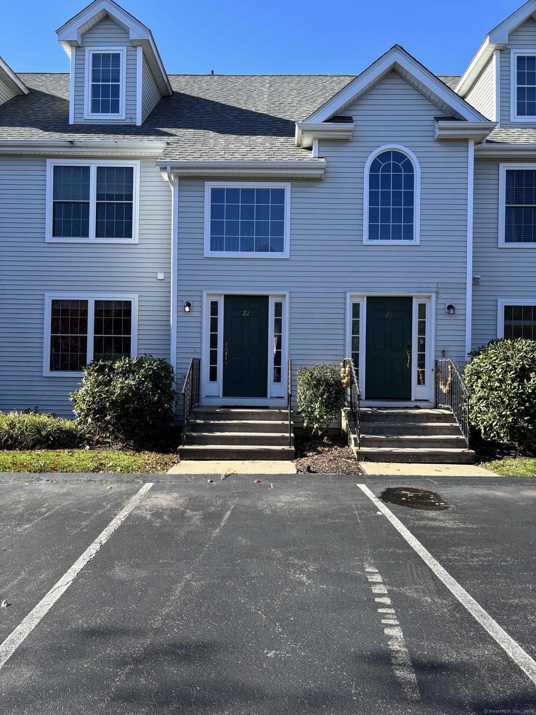 15 Freedom Way, Unit 22 East Lyme, CT 06357 - Photo 1 of 26 a front view of a house with a yard