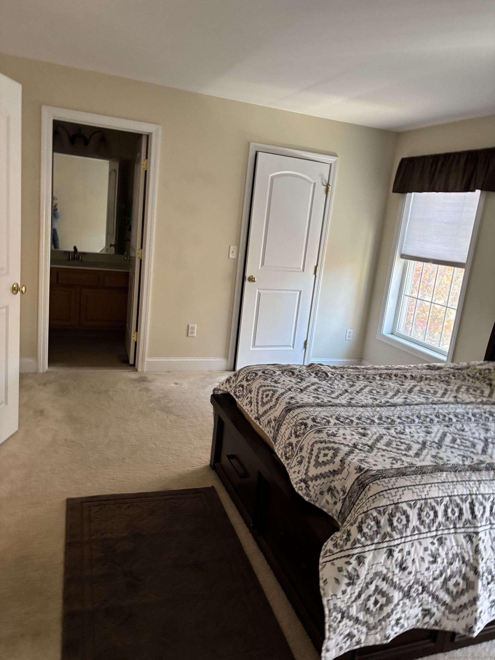 15 Freedom Way, Unit 22 East Lyme, CT 06357 - Photo 13 of 26 a bedroom with a bed and a dresser