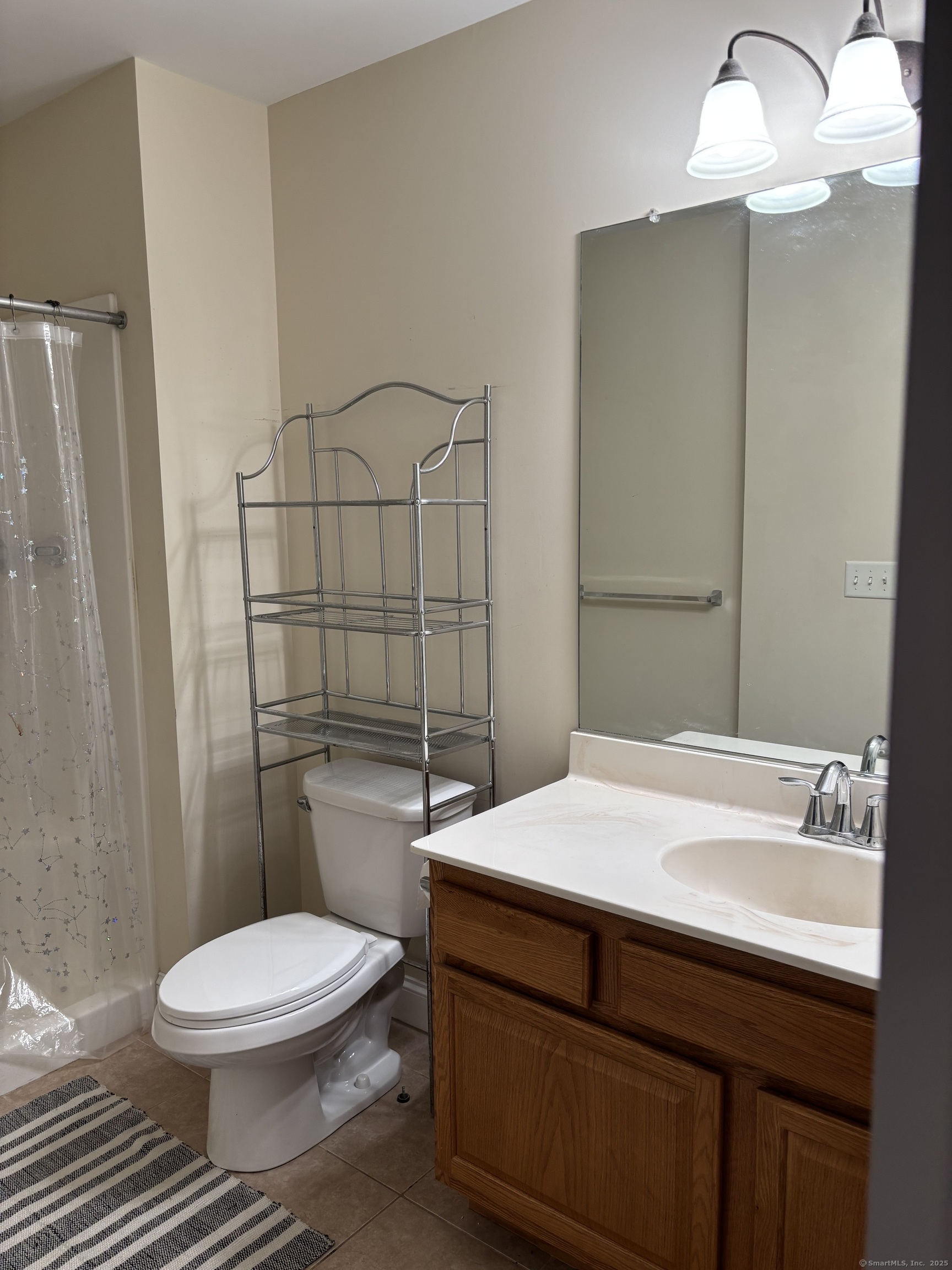 15 Freedom Way, Unit 22 East Lyme, CT 06357 - Photo 14 of 26 a bathroom with a sink a toilet and shower