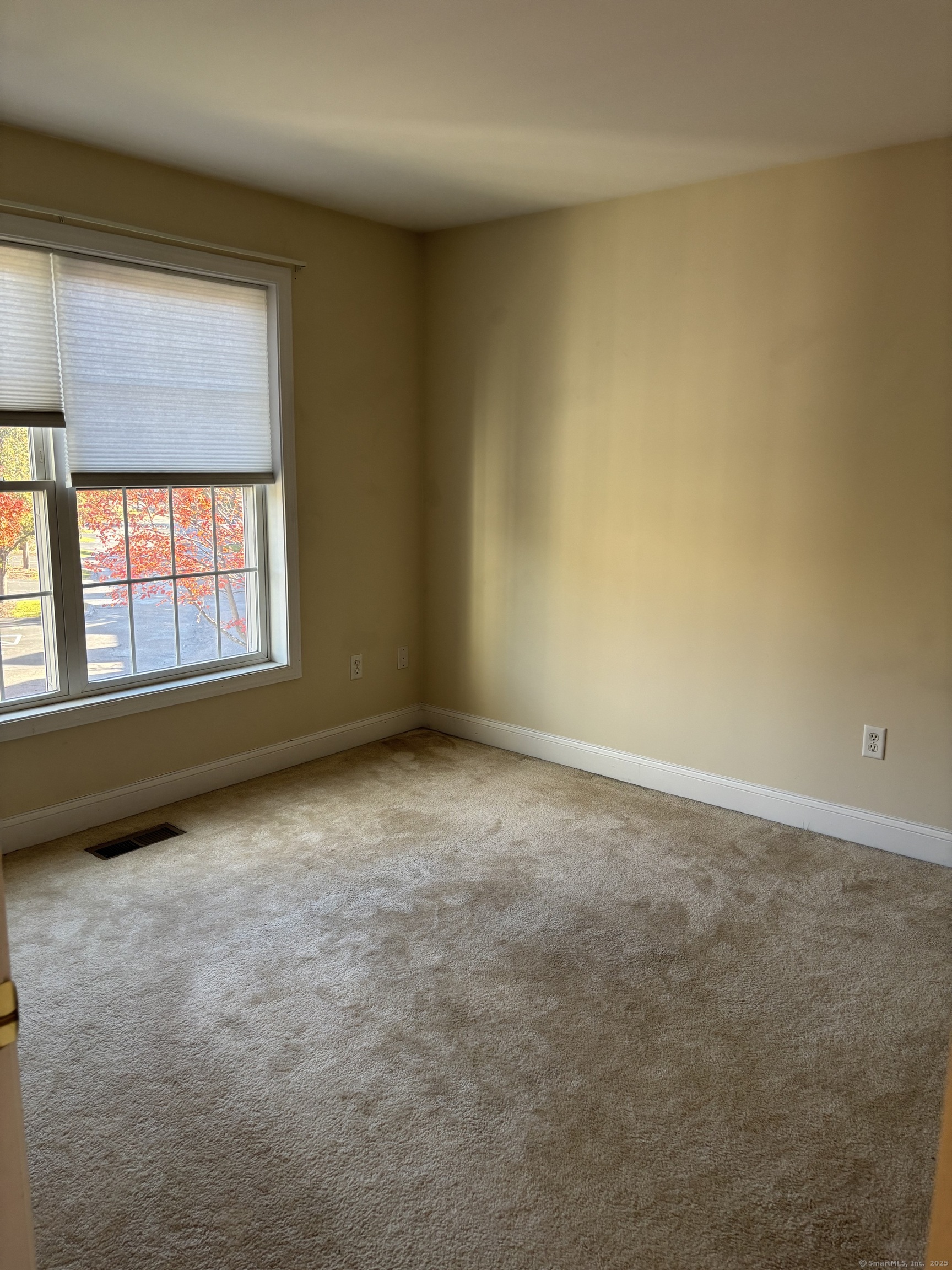 15 Freedom Way, Unit 22 East Lyme, CT 06357 - Photo 16 of 26 an empty room with a window