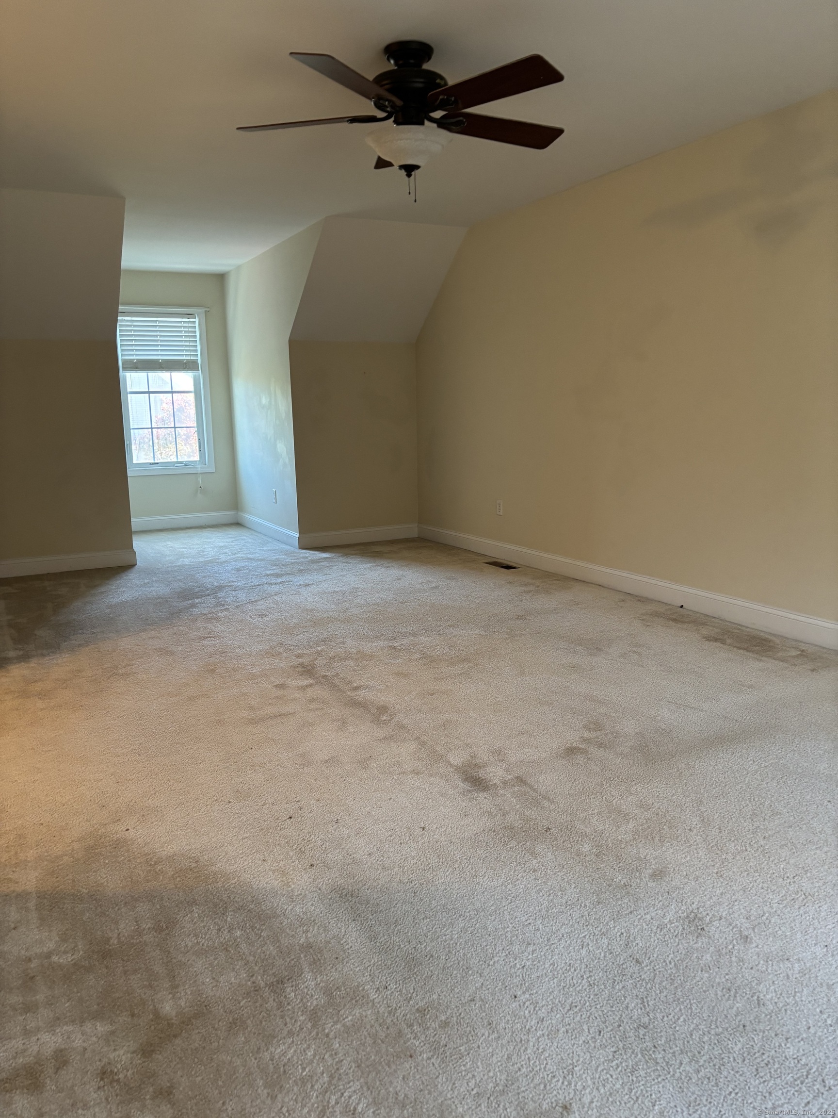 15 Freedom Way, Unit 22 East Lyme, CT 06357 - Photo 20 of 26 a view of a big room with windows and chandelier fan