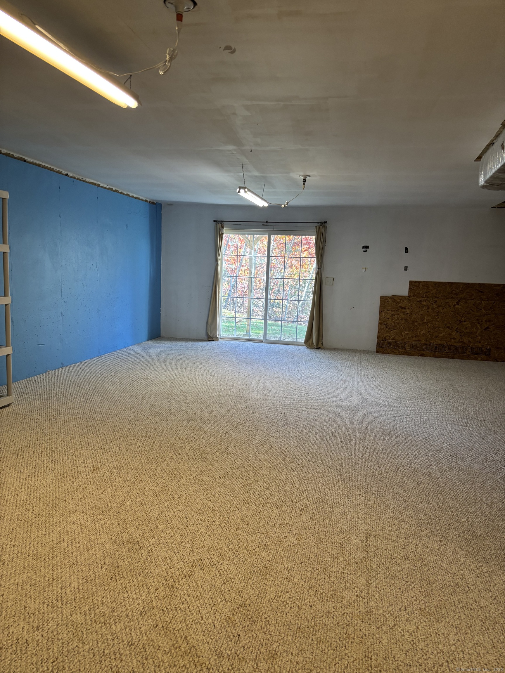 15 Freedom Way, Unit 22 East Lyme, CT 06357 - Photo 25 of 26 a view of an empty room with a window