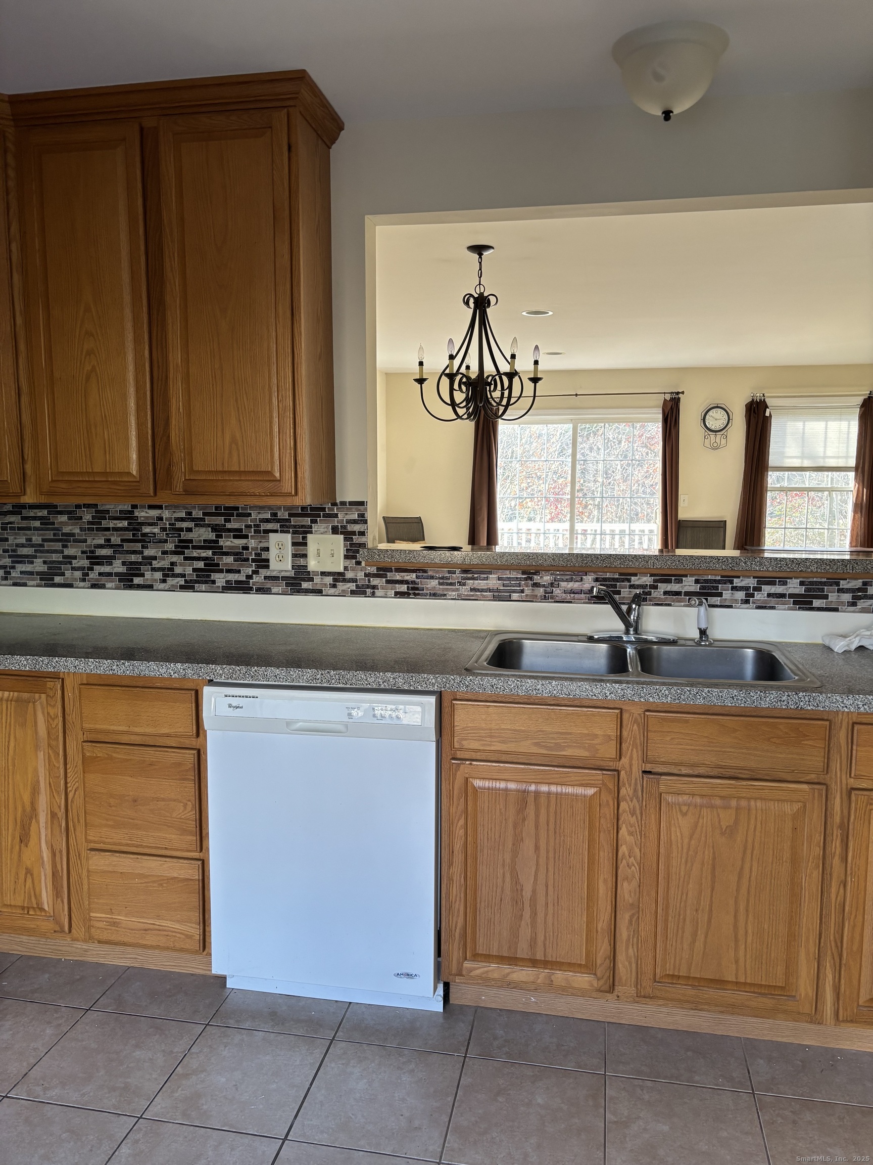 15 Freedom Way, Unit 22 East Lyme, CT 06357 - Photo 3 of 26 a bathroom with a sink and a mirror