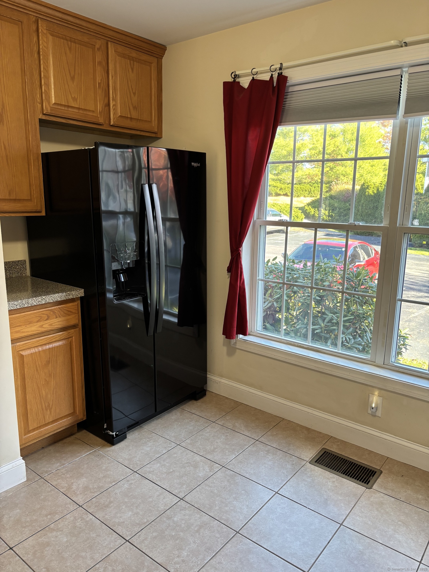 15 Freedom Way, Unit 22 East Lyme, CT 06357 - Photo 5 of 26 a kitchen with a refrigerator and window