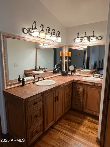a kitchen with a sink a stove and cabinets