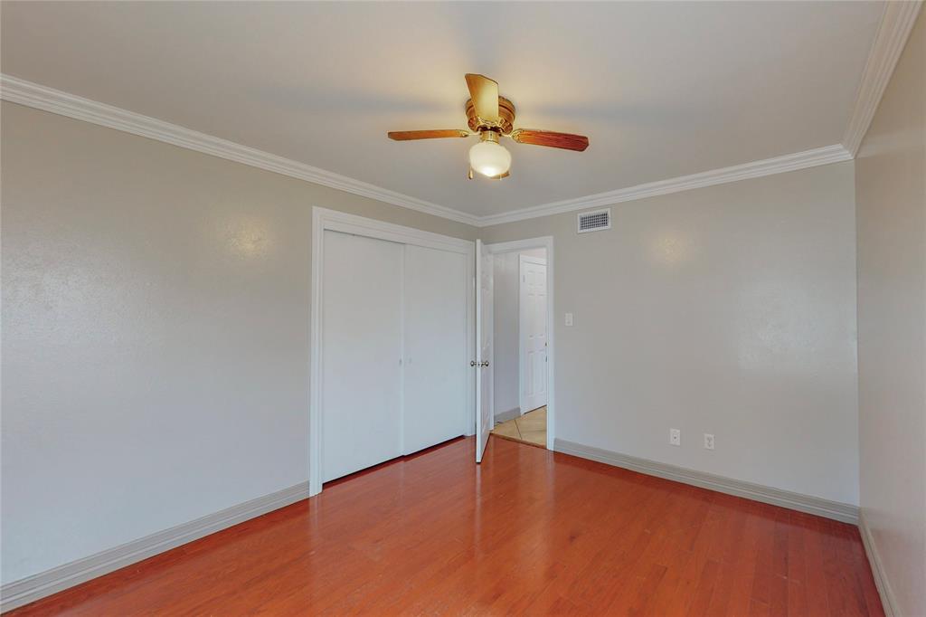 1610 North O'Connor Road Irving, TX 75061 - Photo 16 of 20 a view of an empty room with wooden floor