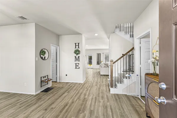 a view of entryway with wooden floor