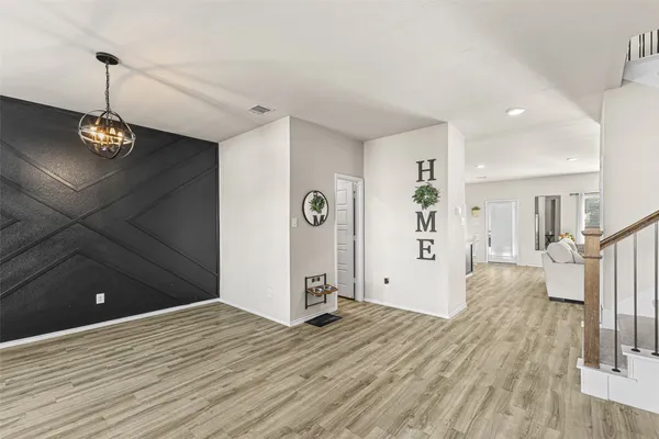 a view of a livingroom with wooden floor