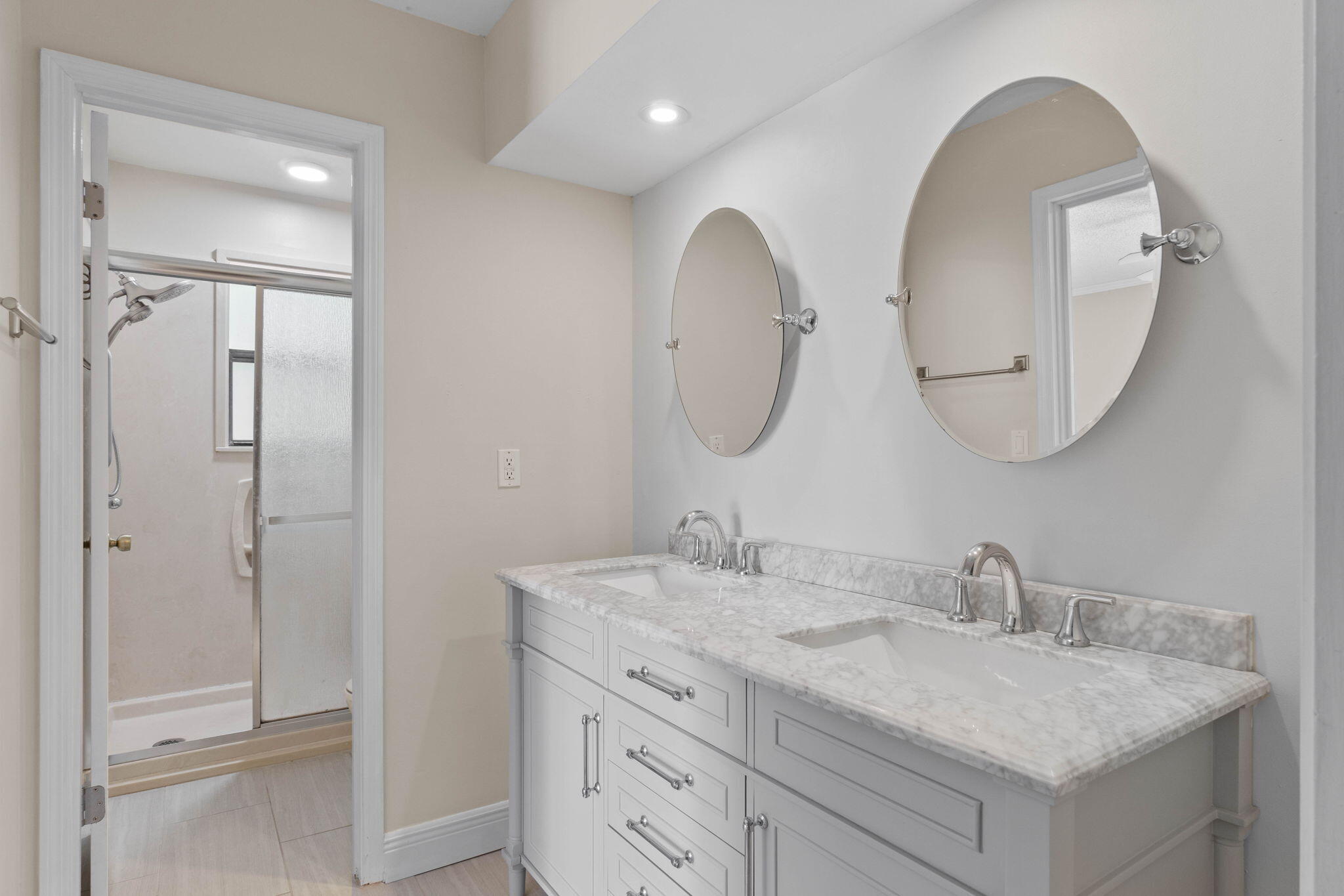 54 Country Club Road Shalimar, FL 32579 - Photo 21 of 58 a bathroom with a double vanity sink and a mirror