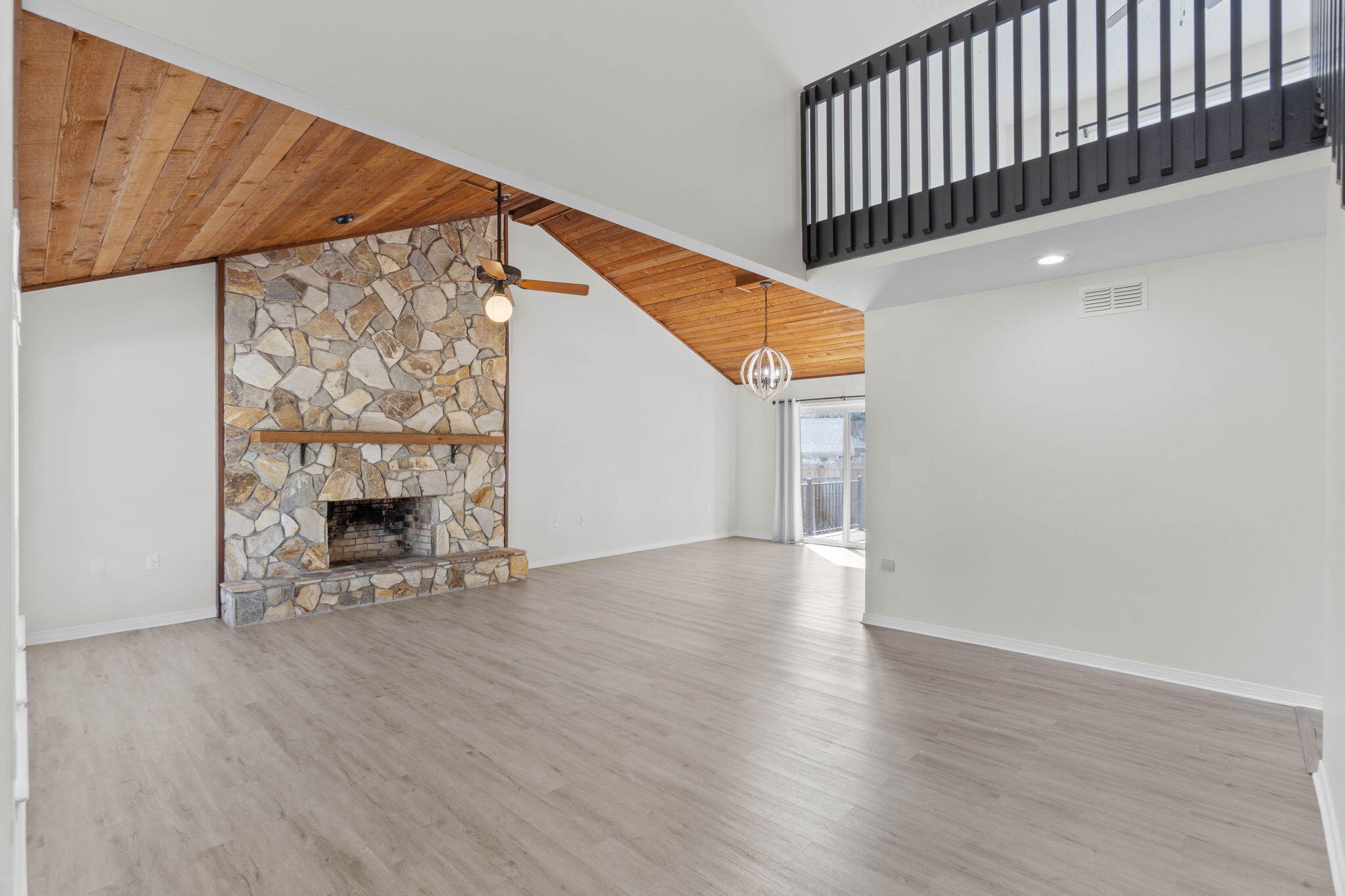 54 Country Club Road Shalimar, FL 32579 - Photo 3 of 58 a view of empty room with wooden floor and fireplace