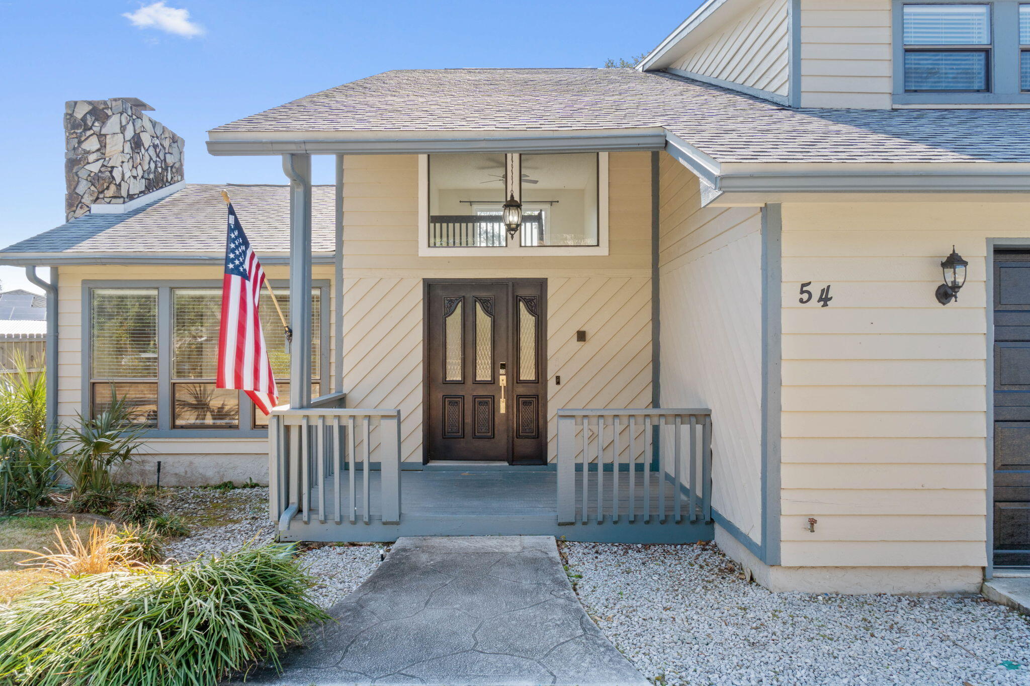 54 Country Club Road Shalimar, FL 32579 - Photo 39 of 58 a view of a house with a small porch