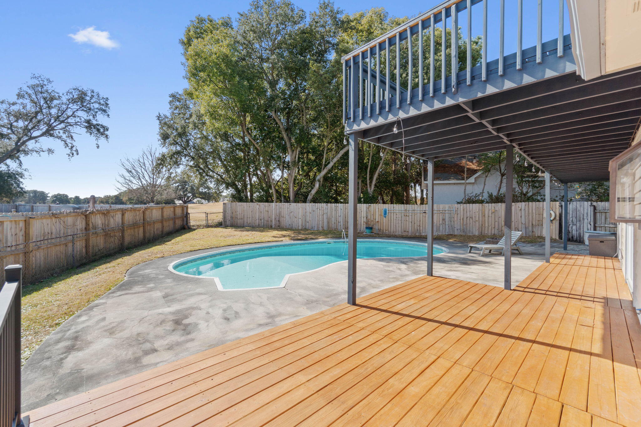 54 Country Club Road Shalimar, FL 32579 - Photo 40 of 58 a view of a swimming pool with a patio