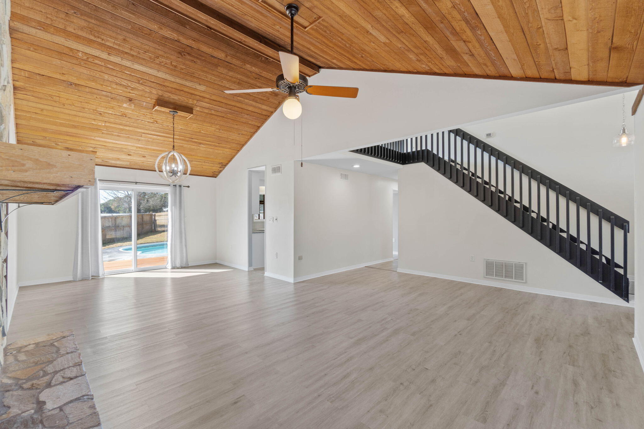 54 Country Club Road Shalimar, FL 32579 - Photo 5 of 58 a view of an empty room with wooden floor