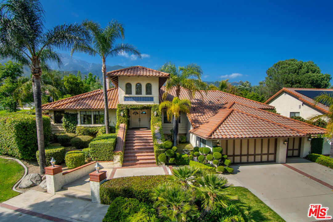 10560 Boulder Canyon Road Rancho Cucamonga, CA 91737 - Photo 1 of 30 a front view of a house with garden