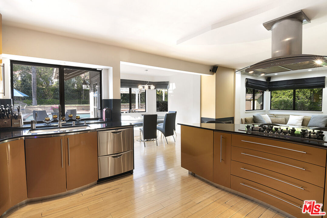 10560 Boulder Canyon Road Rancho Cucamonga, CA 91737 - Photo 15 of 30 a large kitchen with lots of counter space and stainless steel appliances