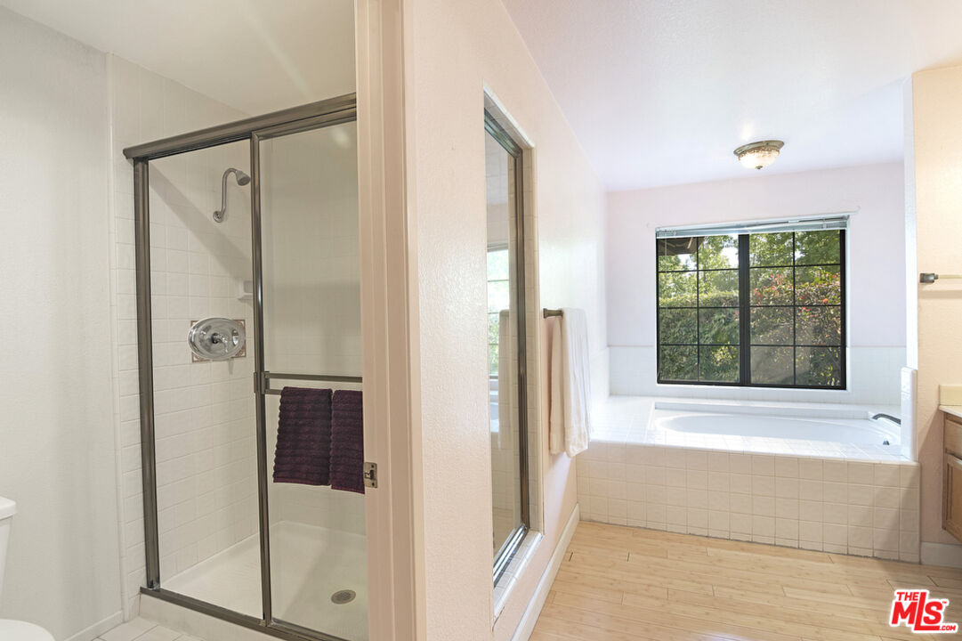 10560 Boulder Canyon Road Rancho Cucamonga, CA 91737 - Photo 18 of 30 a bathroom with a bathtub and a shower