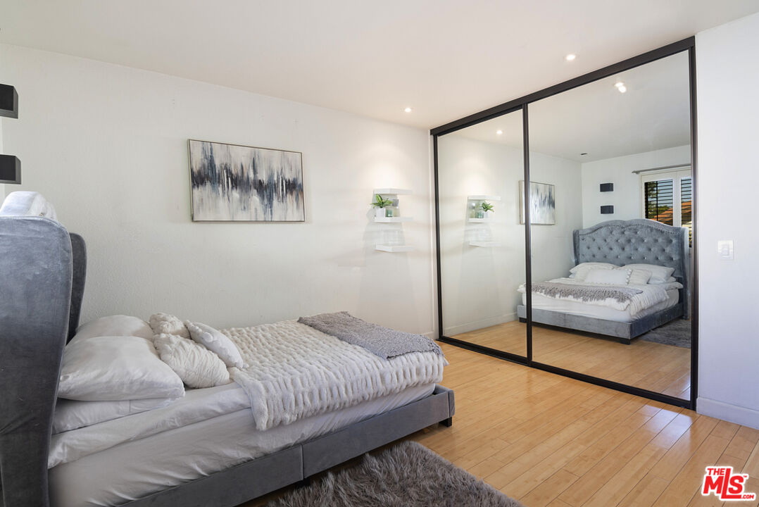 10560 Boulder Canyon Road Rancho Cucamonga, CA 91737 - Photo 21 of 30 a bedroom with a bed and glass window