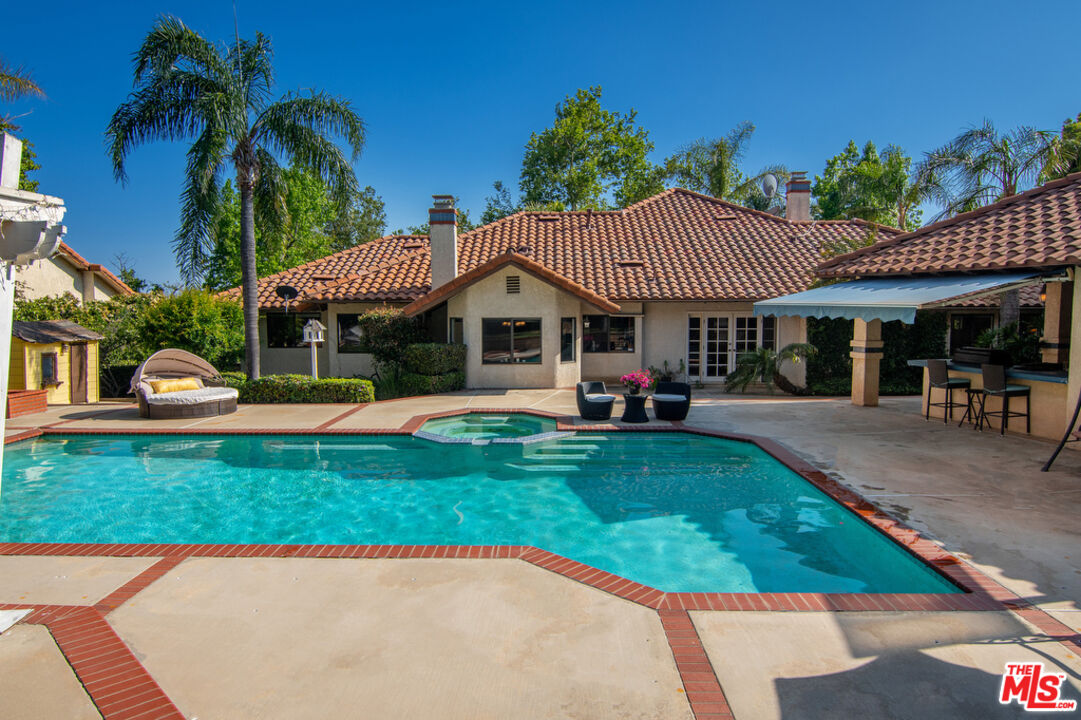 10560 Boulder Canyon Road Rancho Cucamonga, CA 91737 - Photo 25 of 30 a view of a house with a swimming pool