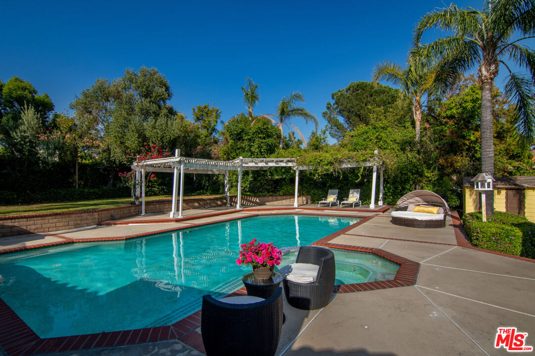 10560 Boulder Canyon Road Rancho Cucamonga, CA 91737 - Photo 26 of 30 a view of a swimming pool with lounge chairs in patio