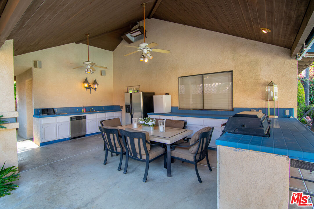 10560 Boulder Canyon Road Rancho Cucamonga, CA 91737 - Photo 27 of 30 a view of a dining room with furniture and wooden floor