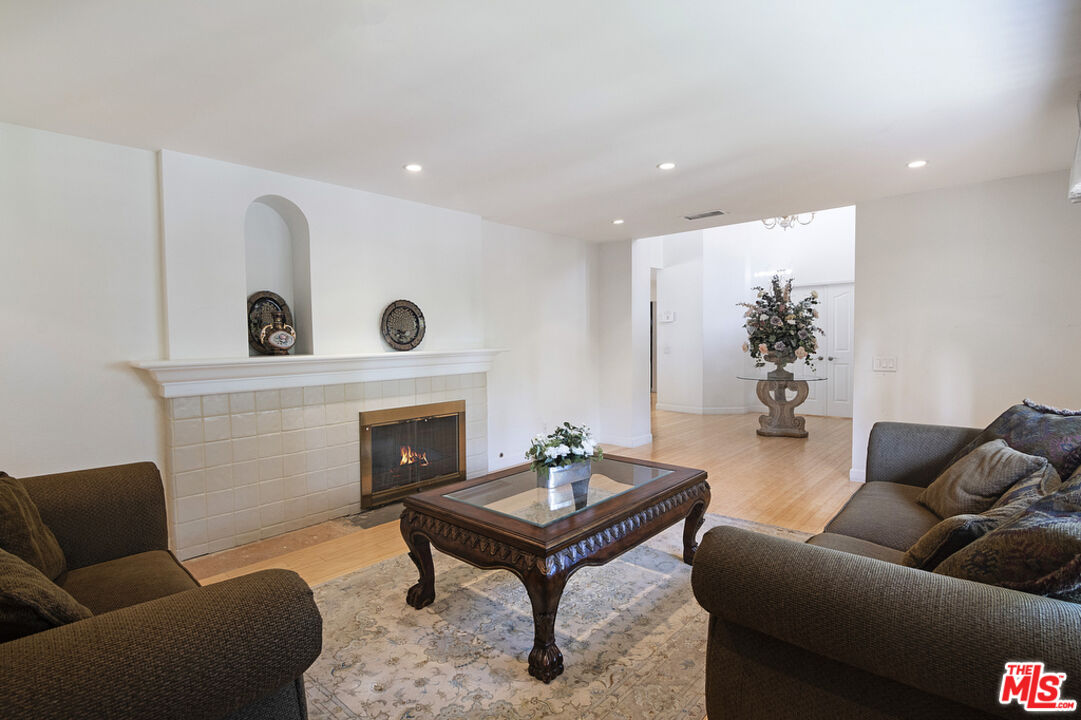 10560 Boulder Canyon Road Rancho Cucamonga, CA 91737 - Photo 7 of 30 a living room with furniture and a fireplace