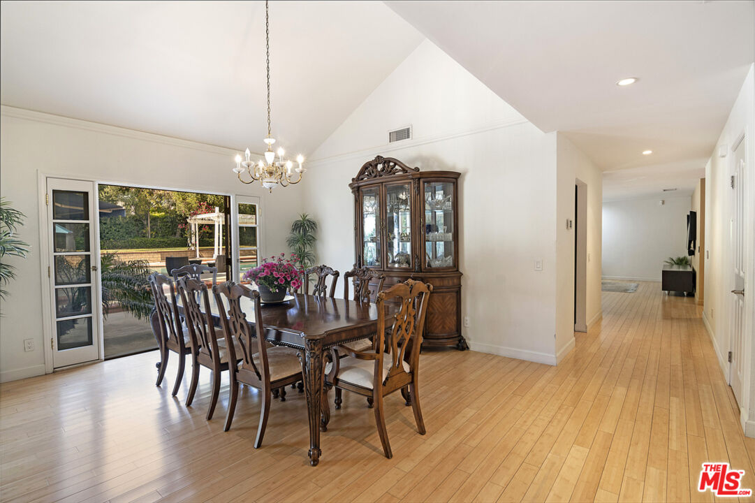 10560 Boulder Canyon Road Rancho Cucamonga, CA 91737 - Photo 8 of 30 a view of a dining room with furniture window and wooden floor