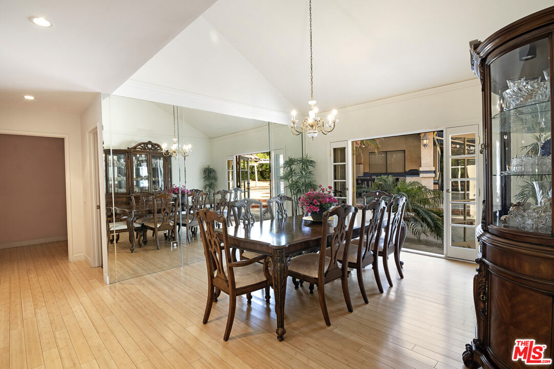 10560 Boulder Canyon Road Rancho Cucamonga, CA 91737 - Photo 9 of 30 a view of a dining room with furniture window and wooden floor
