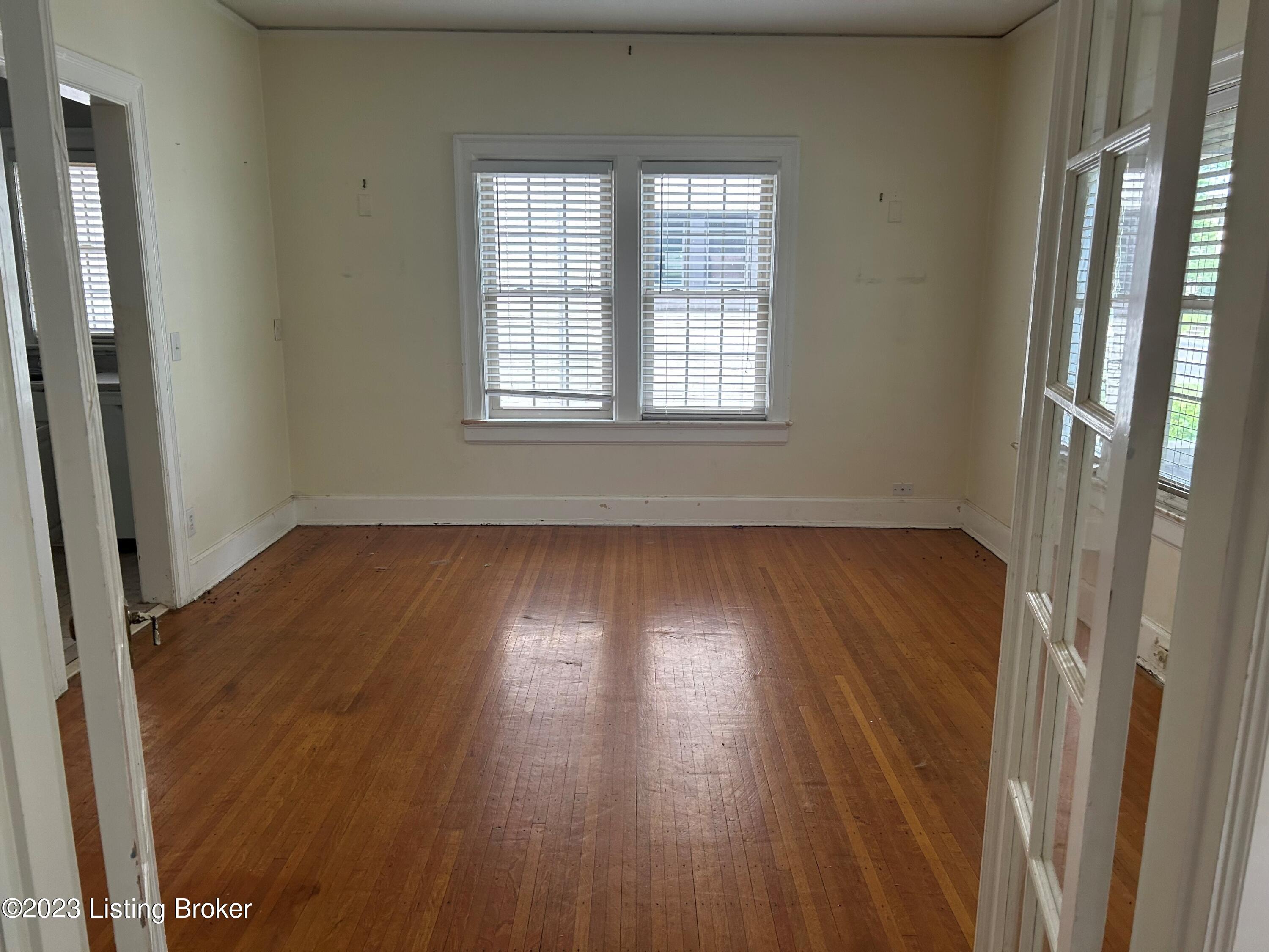 DINING ROOM WITH FRENCH DOORS AND AMPLE WINDOWS