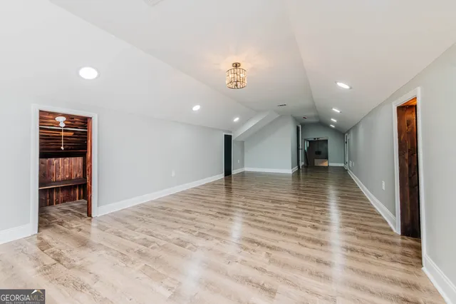 a very nice looking room with a large window with kitchen view
