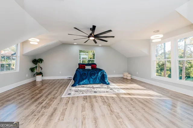 a bathroom with a double vanity sink mirror and next to a window