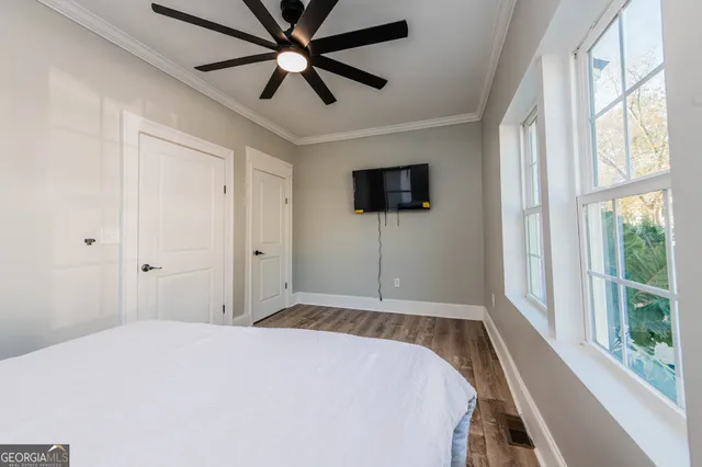 a bathroom with a toilet a sink and a mirror