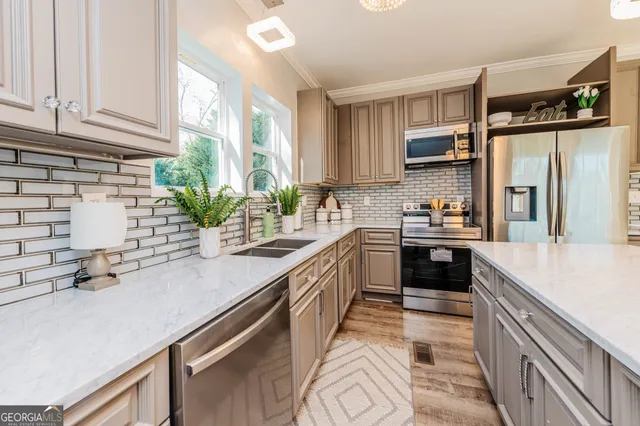 a living room with kitchen island furniture and a table