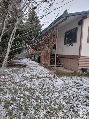 913 East 5300 North Helper, UT 84526 - Photo 2 of 29 View of snow covered exterior featuring stairway
