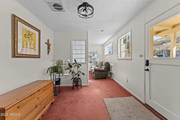 a bed room with furniture and a window