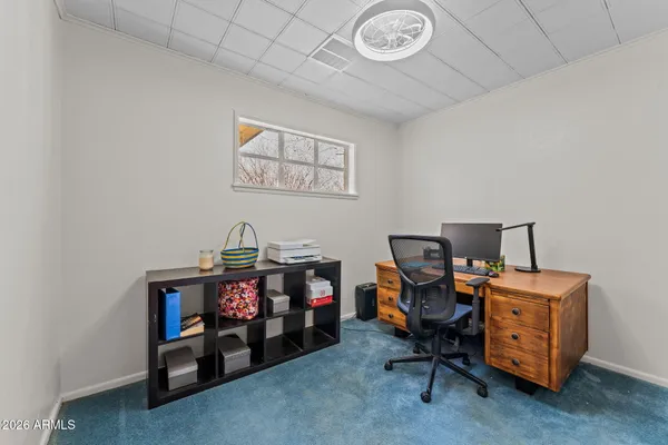 a view of a workspace with furniture