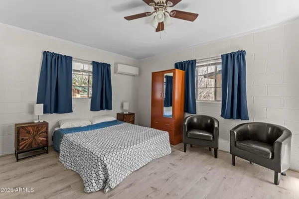 a bedroom with a bed and a couch