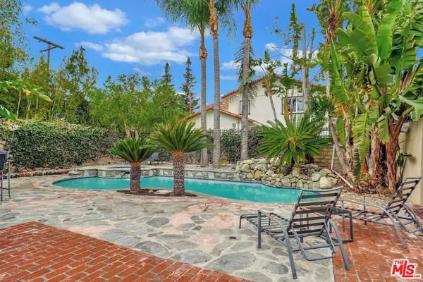 a view of a backyard with a patio