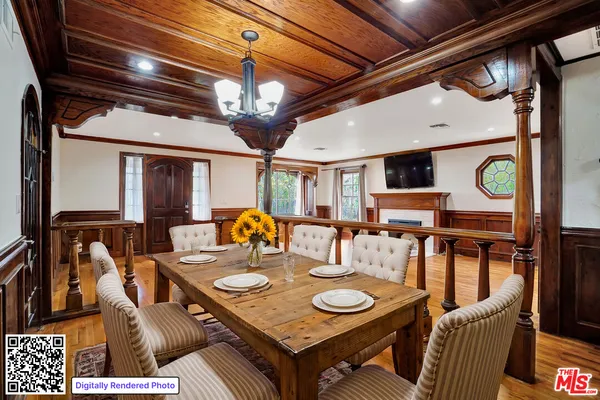 a view of a dining room with furniture and a chandelier