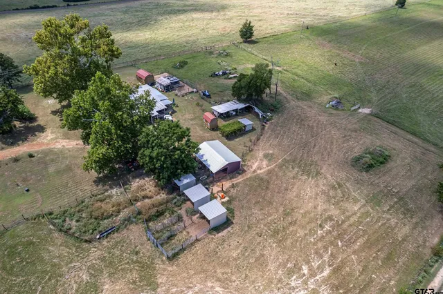 an aerial view of a house with outdoor space