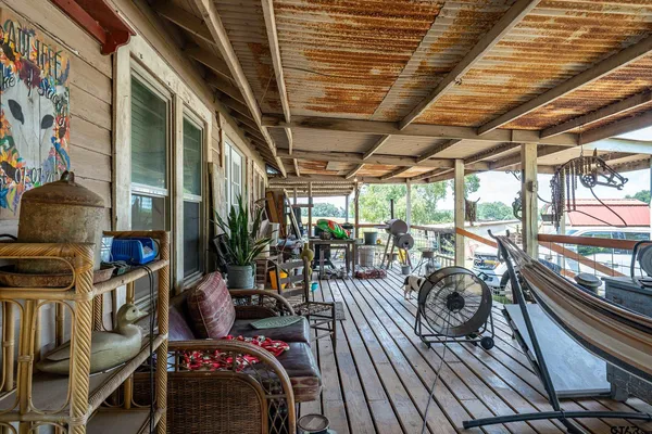 a view of a chair and table in backyard