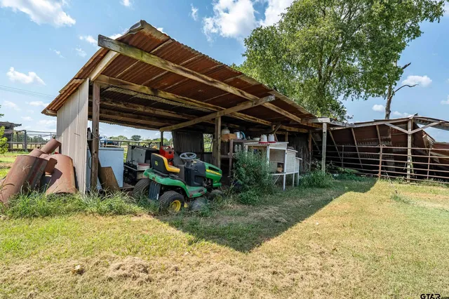 a view of a house with swimming pool and sitting area