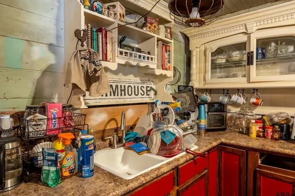 a kitchen with a stove and a refrigerator