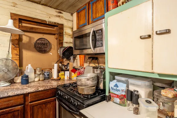 a bedroom with furniture and a potted plant