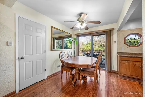 a view of a dining room with furniture window and wooden floor